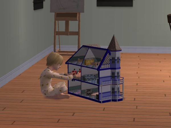 Ferris plays with her dollhouse