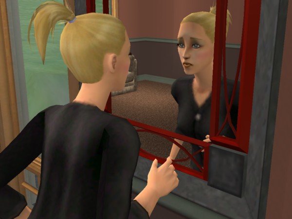 Rhonda looks in the mirror