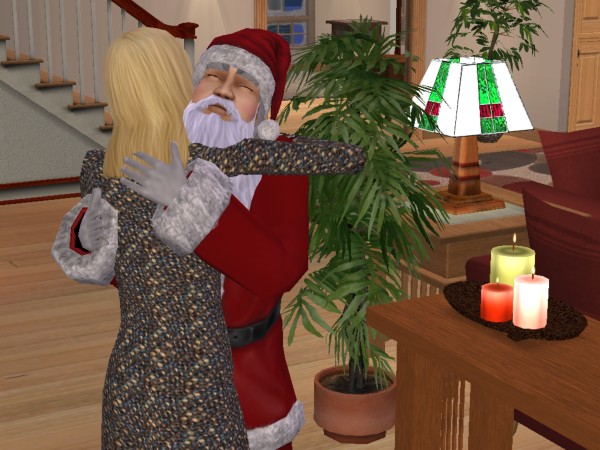 Santa hugs Mom