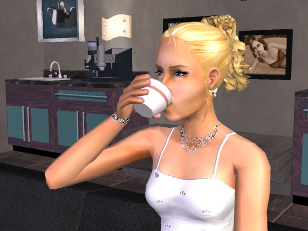 Anastacia drinks espresso